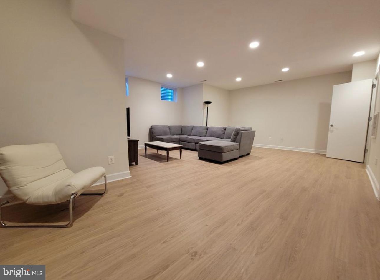1418 44th Street Northwest, Unit B Washington, DC 20007 - Photo 2 of 20 a living room with furniture and a wooden floor