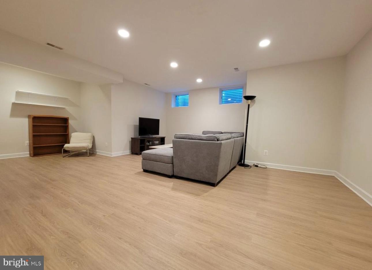 1418 44th Street Northwest, Unit B Washington, DC 20007 - Photo 3 of 20 a living room with furniture and a flat screen tv
