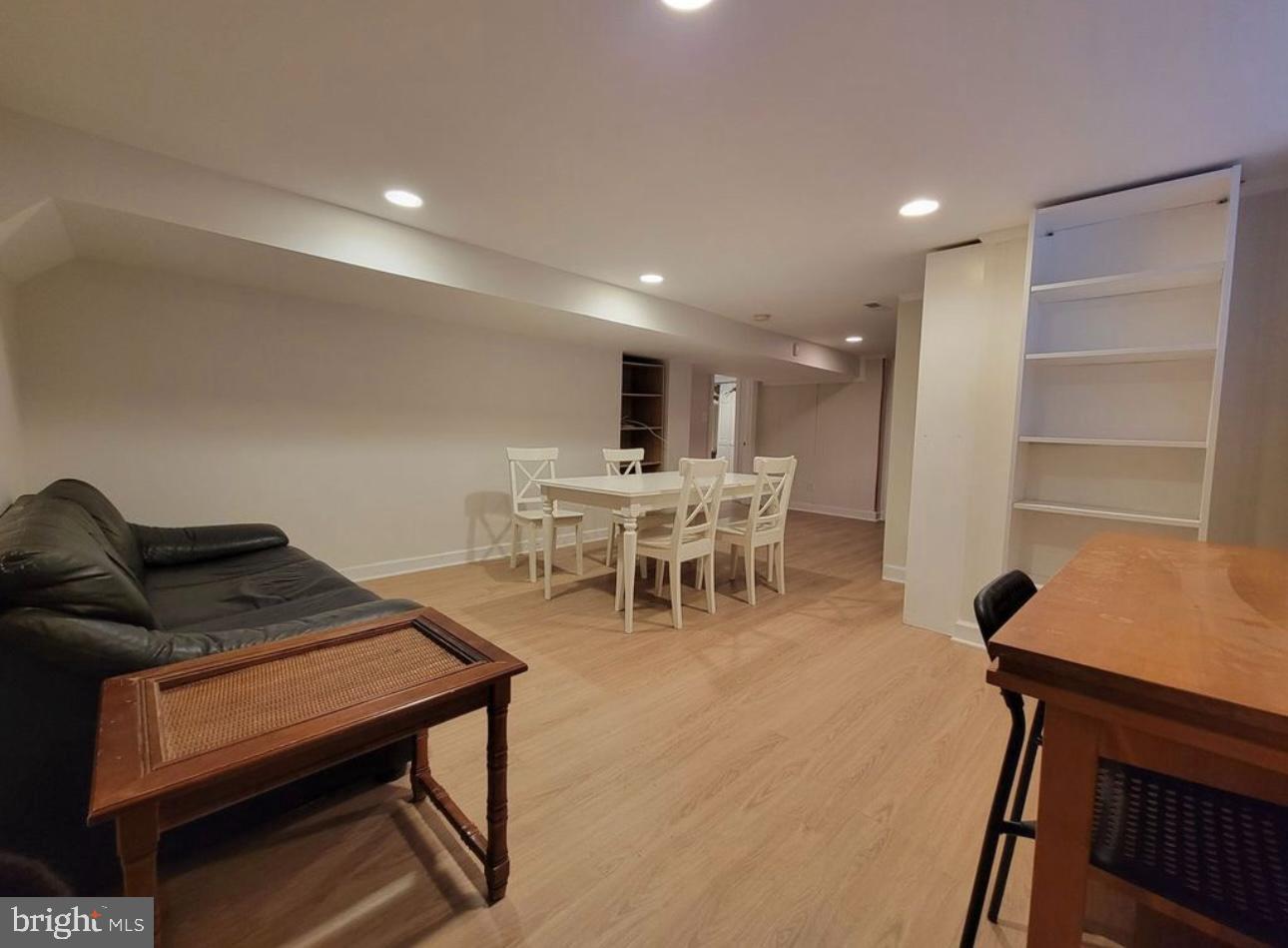 1418 44th Street Northwest, Unit B Washington, DC 20007 - Photo 7 of 20 a living room with furniture and a chair