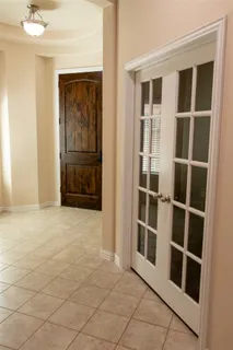 a view of an empty room with cabinet