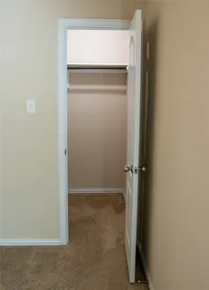 an empty room with closet