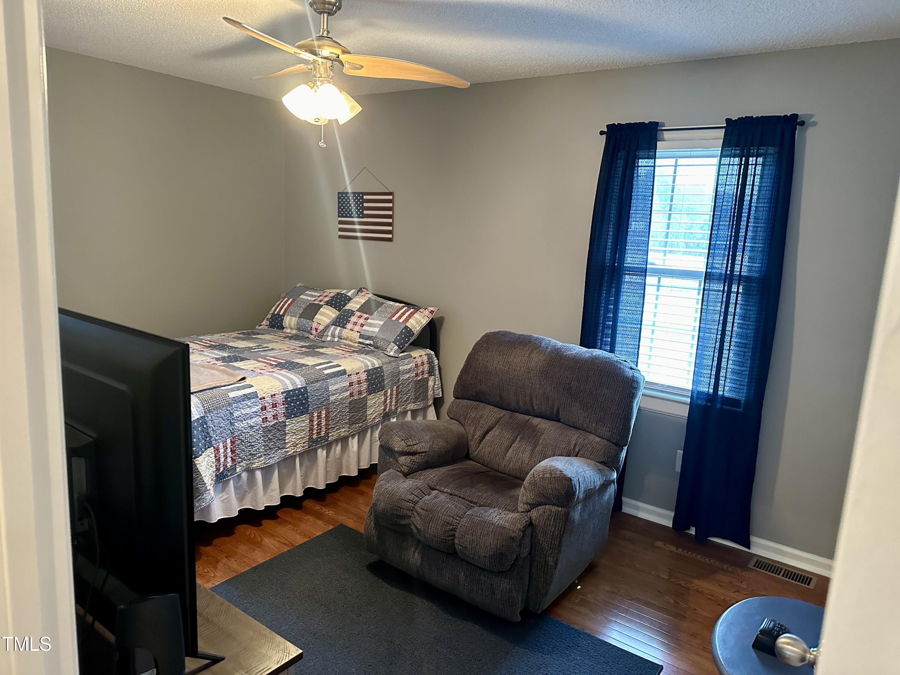 242 Edwards Road Henderson, NC 27537 - Photo 16 of 21 a bedroom with bed and a window