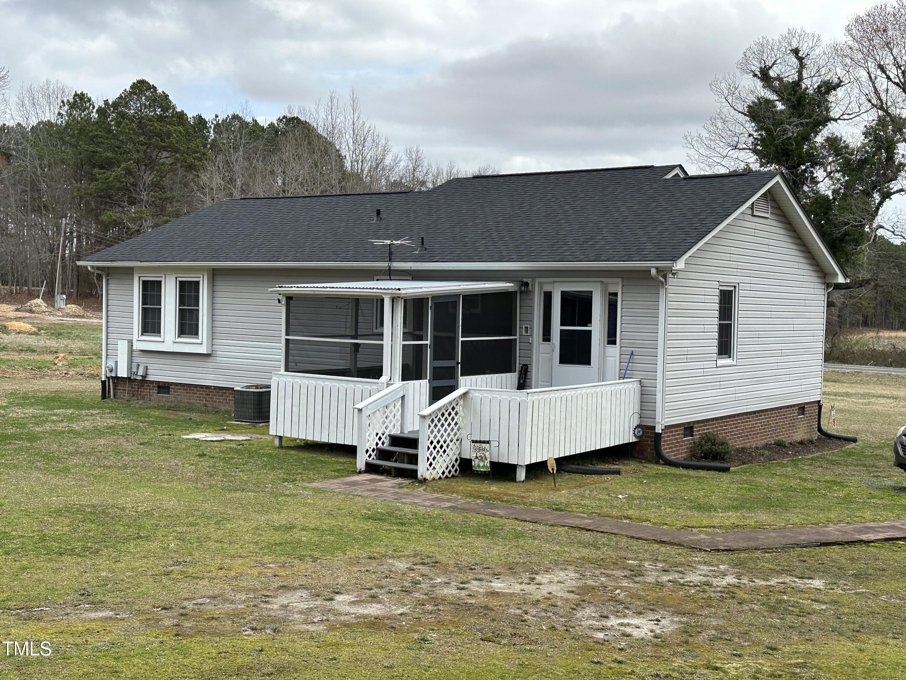 242 Edwards Road Henderson, NC 27537 - Photo 2 of 21 a view of a house with a yard porch and sitting area