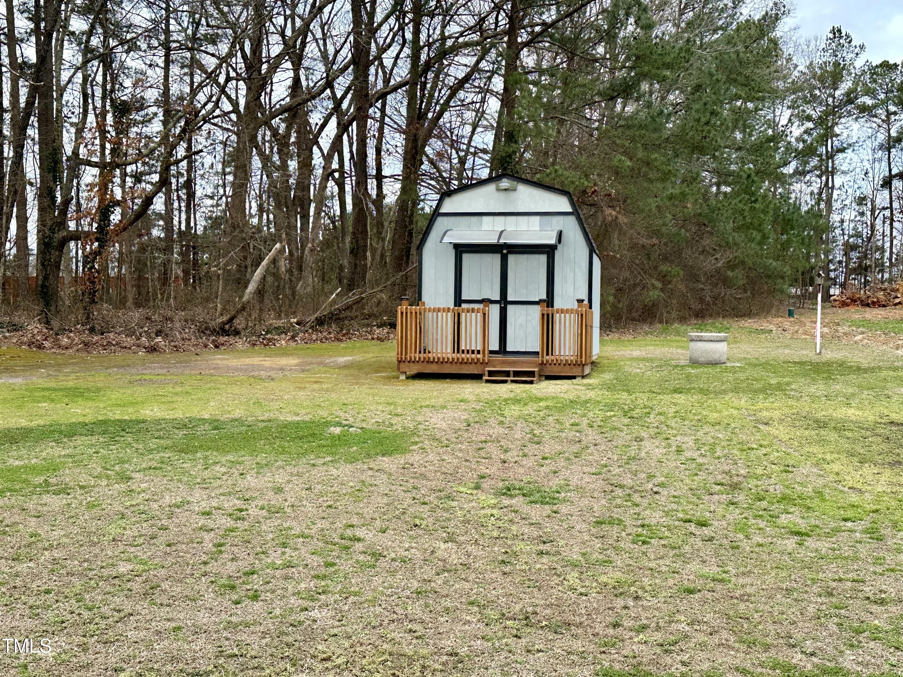 242 Edwards Road Henderson, NC 27537 - Photo 21 of 21 a view of a house with a yard