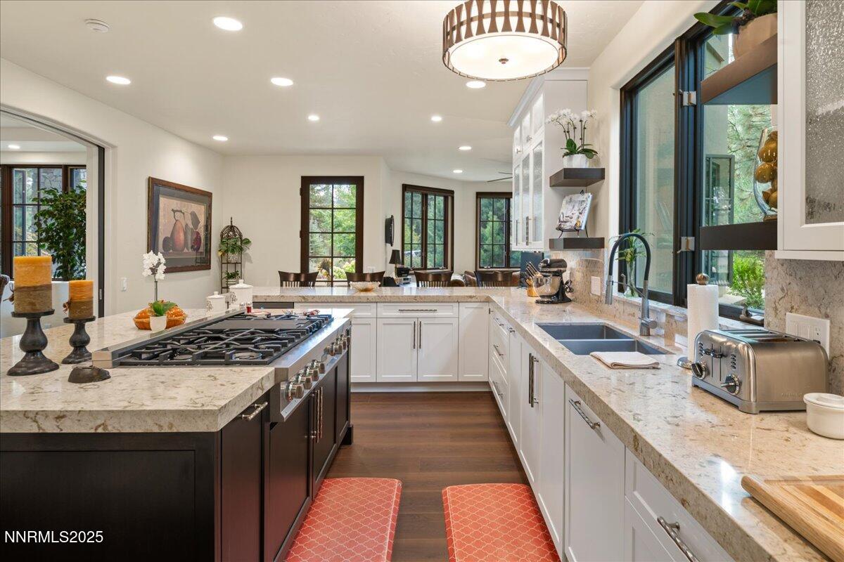 5945 Chambery Circle Reno, NV 89511 - Photo 13 of 62 a kitchen with stainless steel appliances granite countertop a sink and a stove