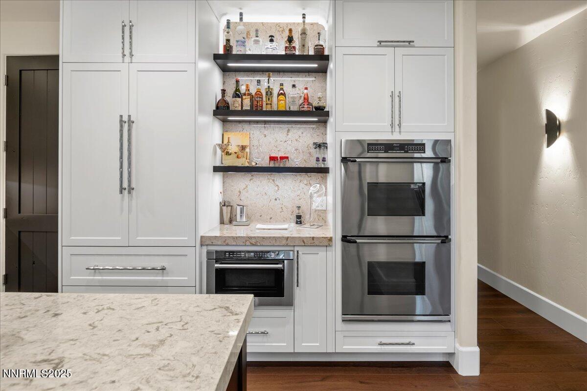 5945 Chambery Circle Reno, NV 89511 - Photo 16 of 62 a kitchen with stainless steel appliances granite countertop a refrigerator and a stove