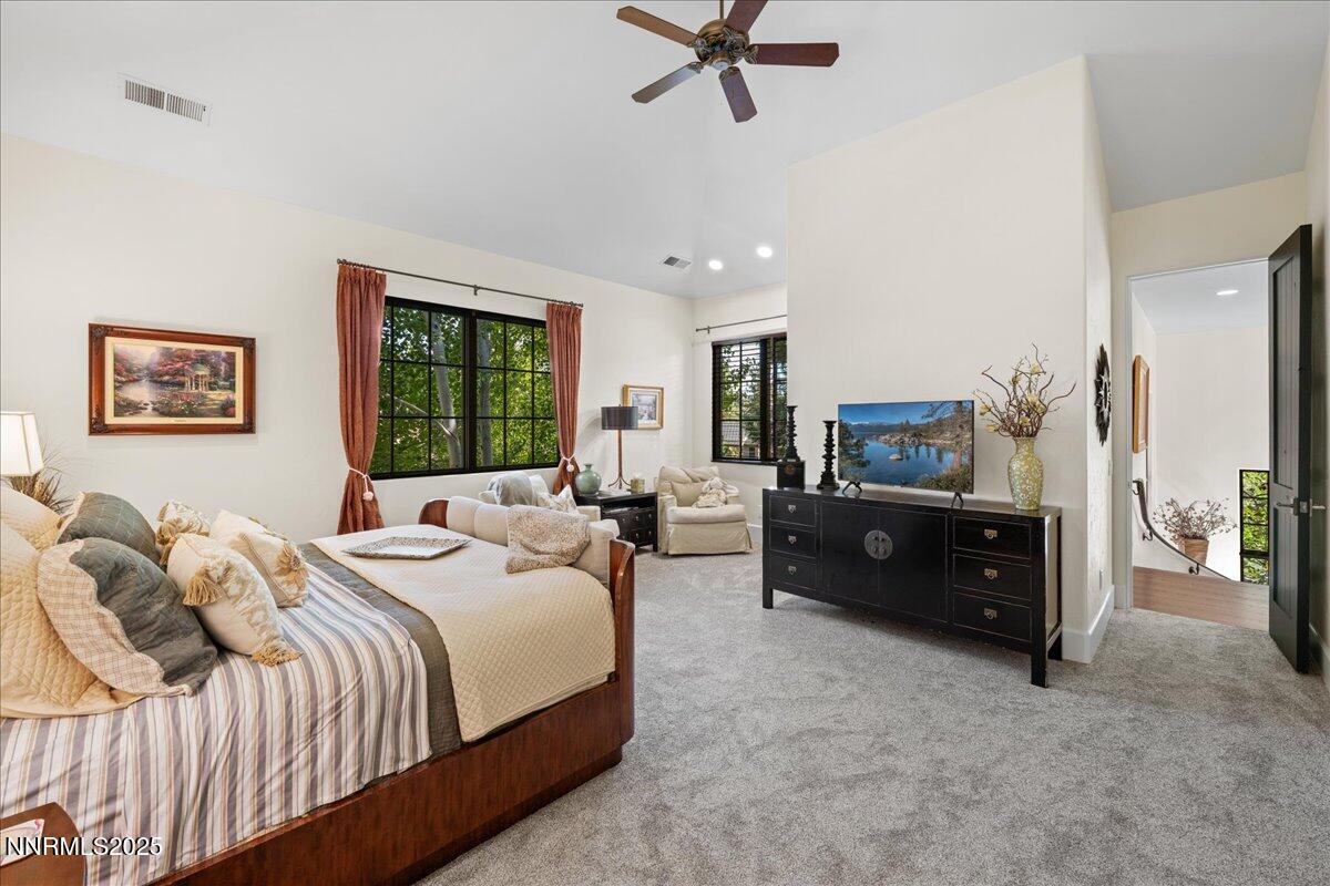 5945 Chambery Circle Reno, NV 89511 - Photo 23 of 62 a bedroom with a bed a couch and a window