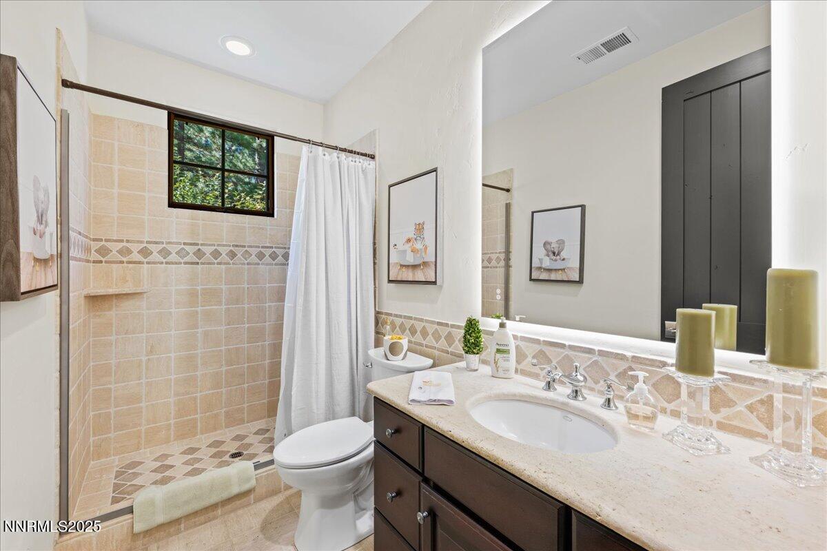 5945 Chambery Circle Reno, NV 89511 - Photo 29 of 62 a bathroom with a sink a toilet and shower