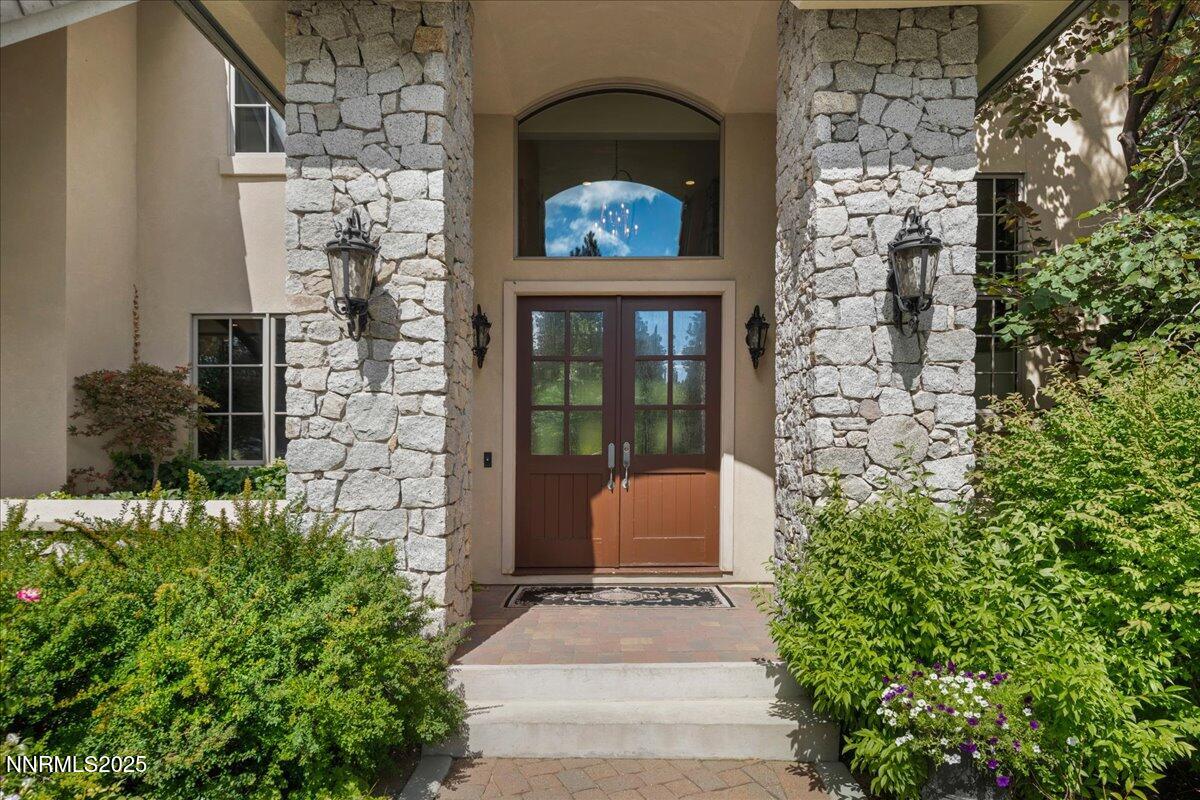 5945 Chambery Circle Reno, NV 89511 - Photo 4 of 62 a front view of a house with a garden