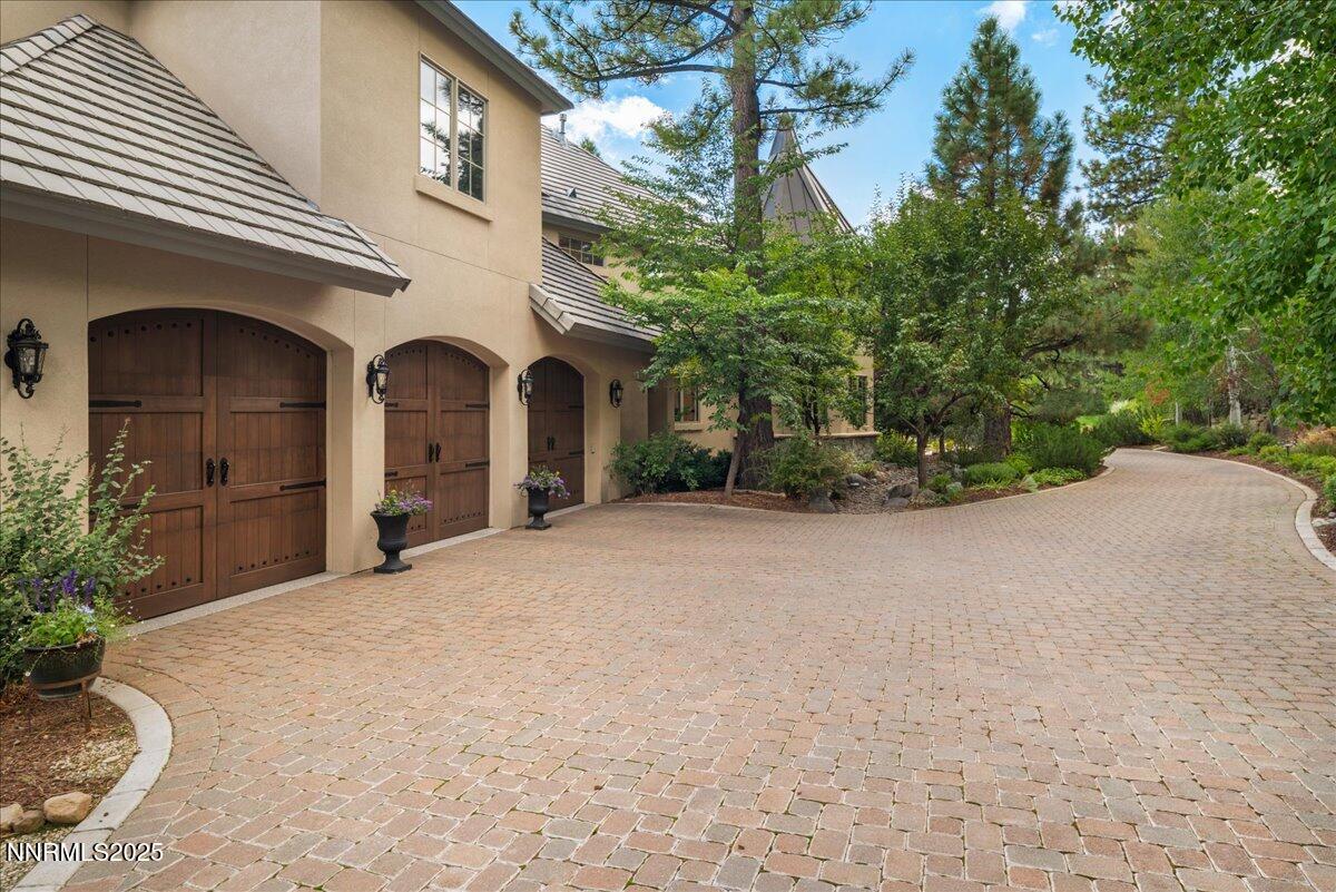 5945 Chambery Circle Reno, NV 89511 - Photo 56 of 62 a view of a house with a yard and garage