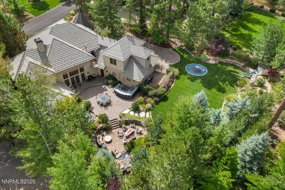 5945 Chambery Circle Reno, NV 89511 - Photo 57 of 62 an aerial view of a house with a yard and trees
