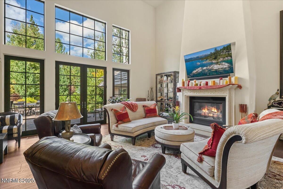 5945 Chambery Circle Reno, NV 89511 - Photo 10 of 62 a living room with furniture a fireplace and a large window