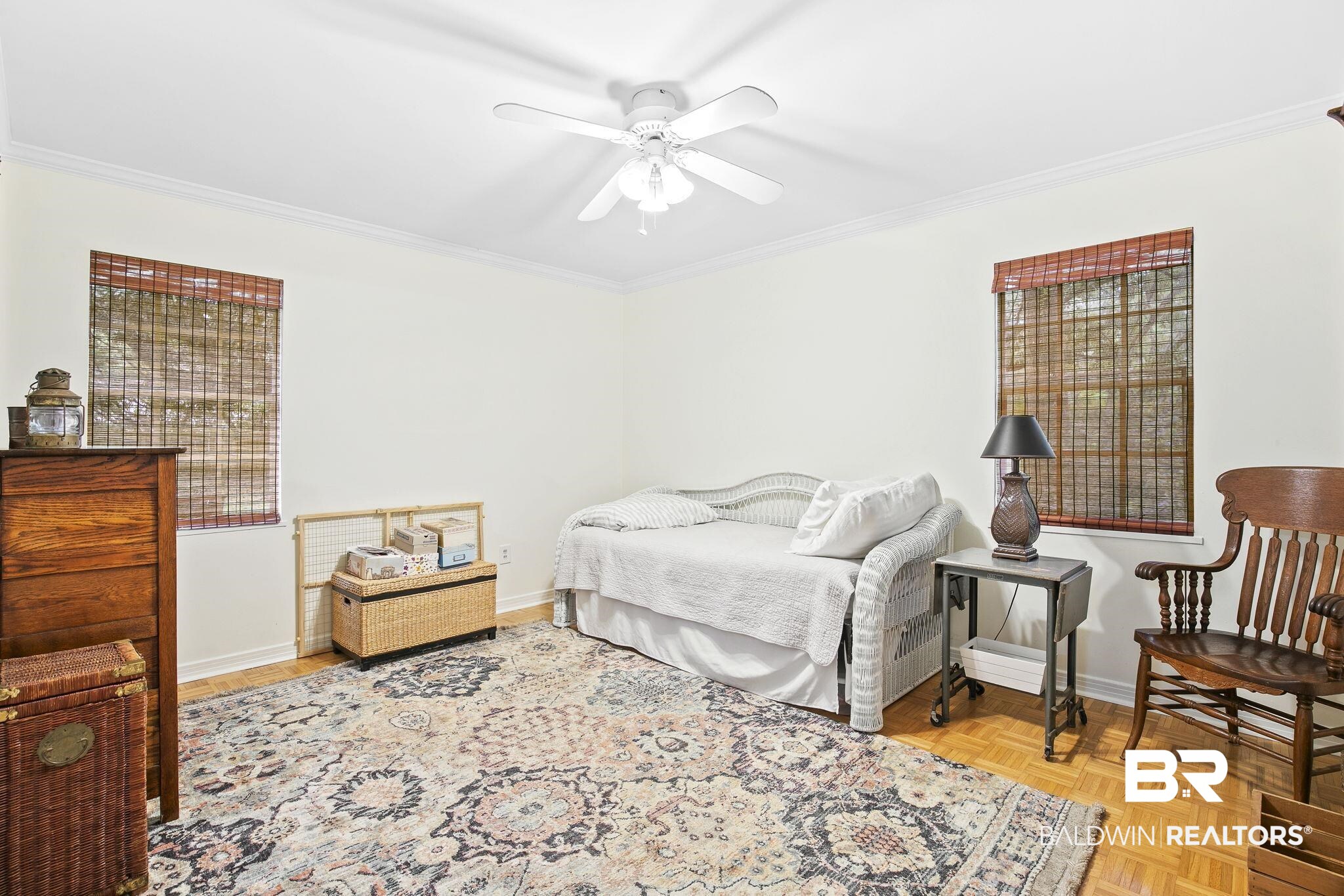 599 Hancock Road Fairhope, AL 36532 - Photo 15 of 23 Bedroom featuring ceiling fan, light parquet flooring, and ornamental molding