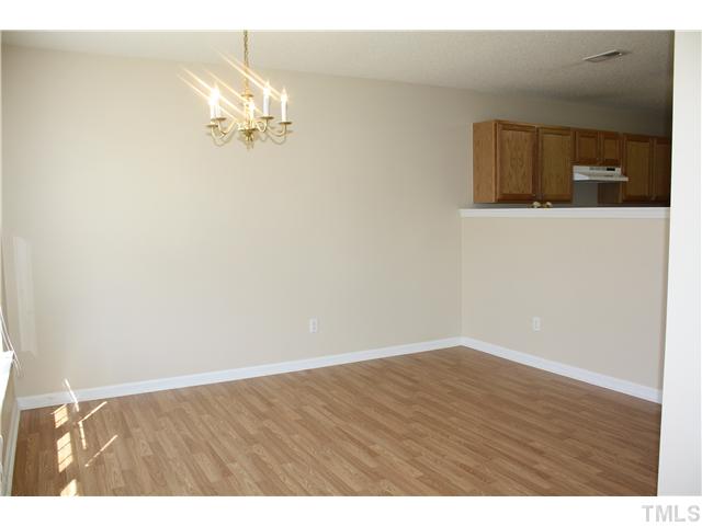 4407 Snowcrest Lane Raleigh, NC 27616 - Photo 3 of 8 a view of an empty room with wooden floor