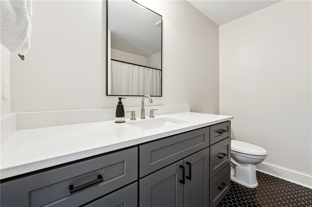 38 Mountain Ridge Road Northeast White, GA 30184 - Photo 53 of 79 a bathroom with a sink toilet and mirror