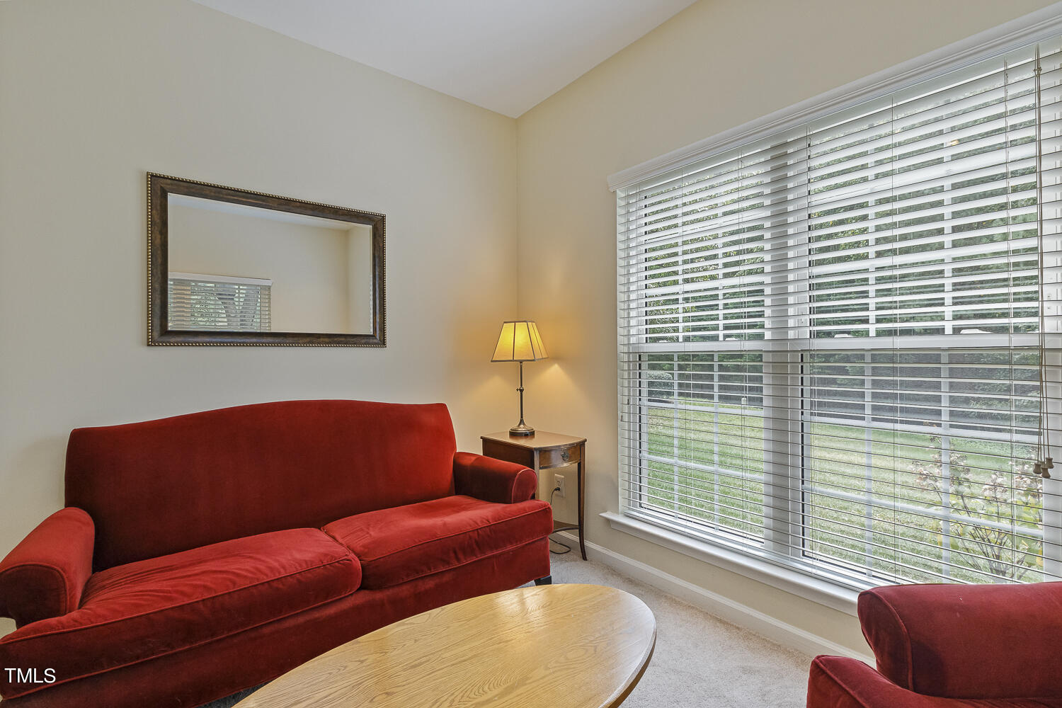 1001 Lake Moraine Place Raleigh, NC 27607 - Photo 19 of 37 a blue couch sitting in front of a window