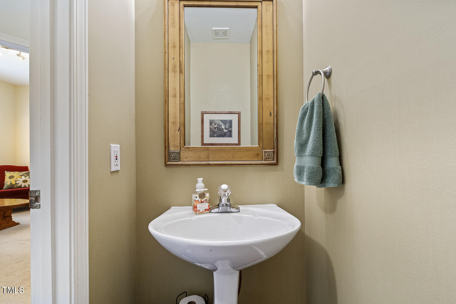 1001 Lake Moraine Place Raleigh, NC 27607 - Photo 21 of 37 a bathroom with a sink and a mirror