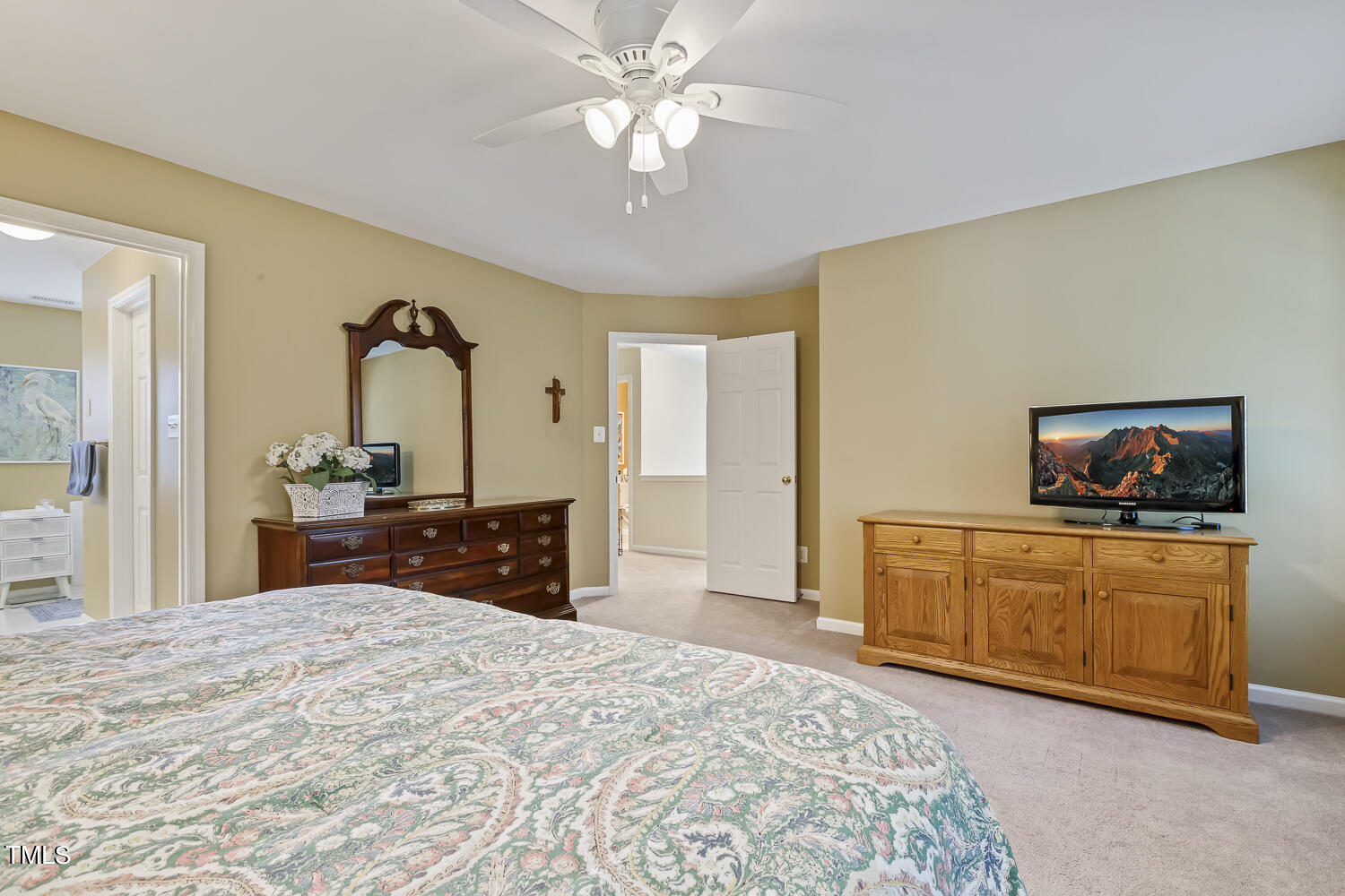 1001 Lake Moraine Place Raleigh, NC 27607 - Photo 25 of 37 a bedroom with a bed and a dresser in it