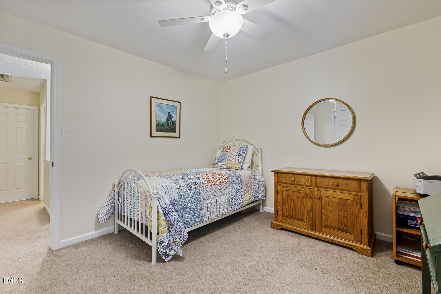 1001 Lake Moraine Place Raleigh, NC 27607 - Photo 31 of 37 a bed room with a bed and a chandelier