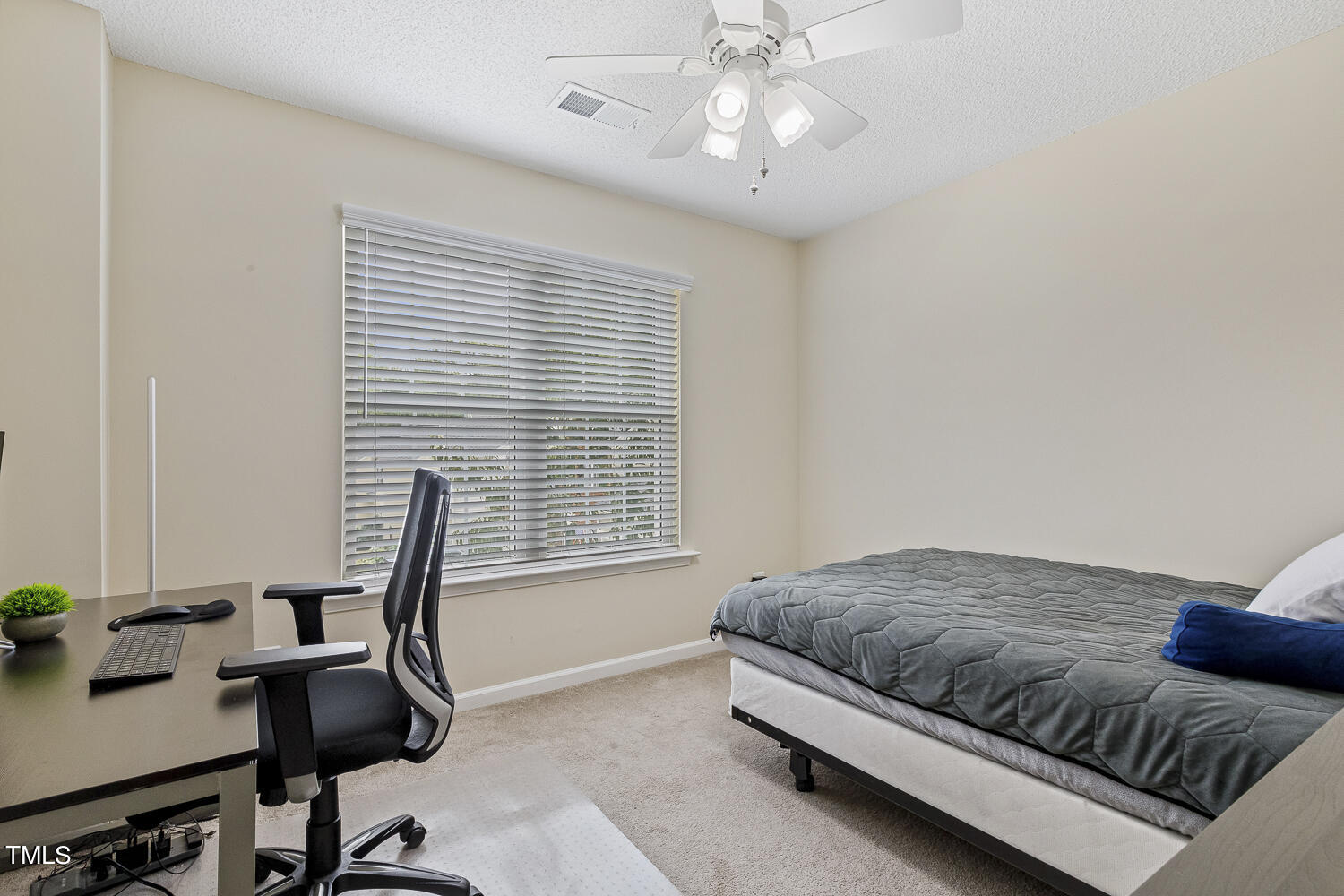 1001 Lake Moraine Place Raleigh, NC 27607 - Photo 33 of 37 a bedroom with a bed and a desk
