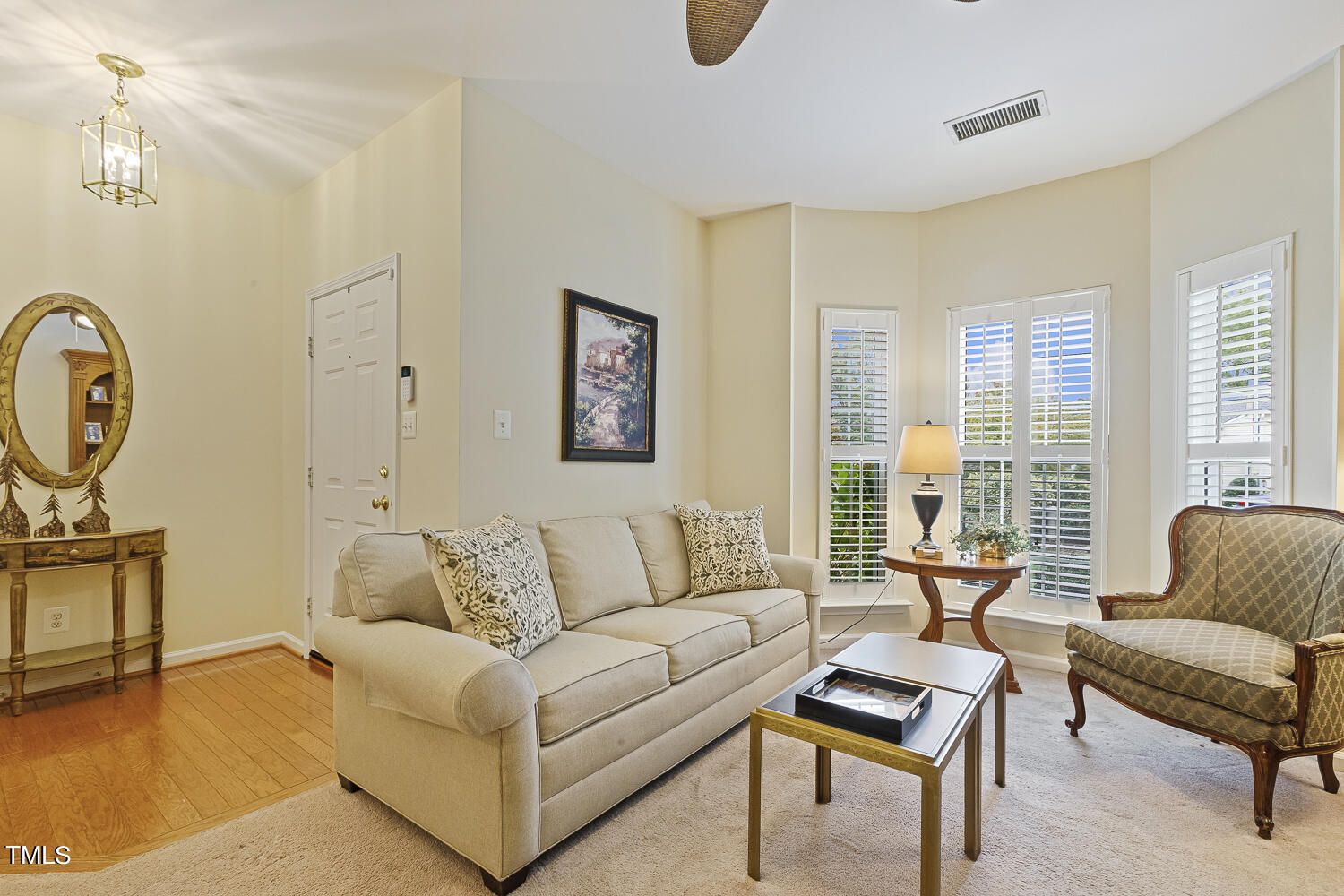 1001 Lake Moraine Place Raleigh, NC 27607 - Photo 5 of 37 a living room with furniture and a large window