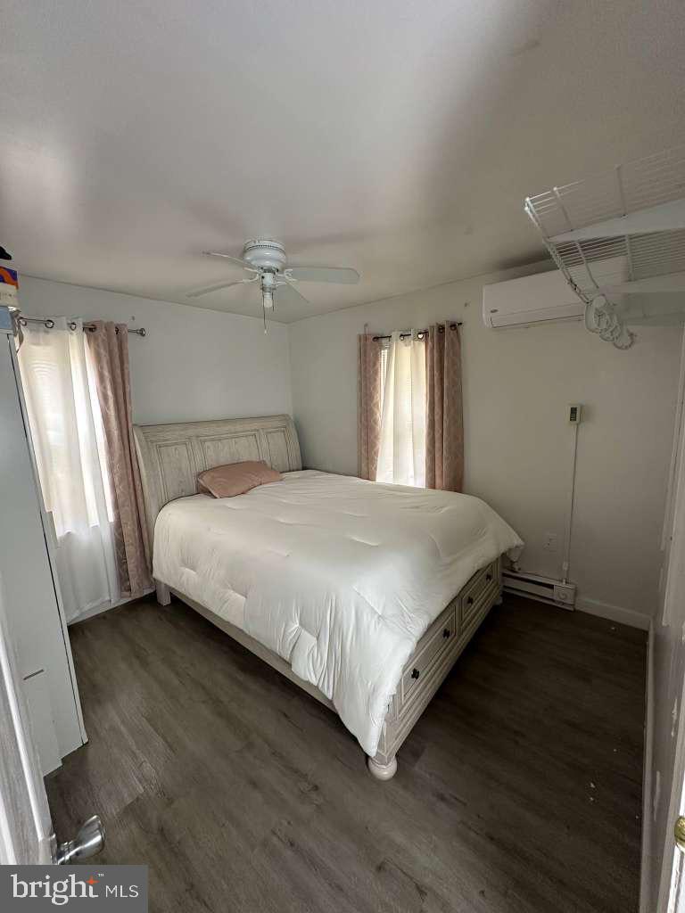 1536 Rothley Avenue Abington, PA 19090 - Photo 13 of 21 a large bed sitting in a bedroom next to a window and a chandelier