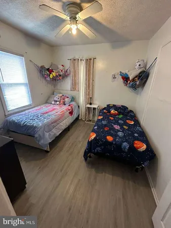 a bedroom with bed and a window