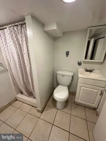 a bedroom with a bed and a walk in closet