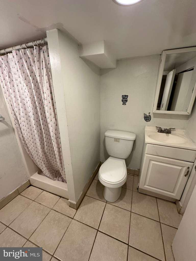 1536 Rothley Avenue Abington, PA 19090 - Photo 17 of 21 a bathroom with a toilet and a sink