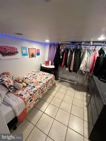 a bedroom with a bed and a lamp