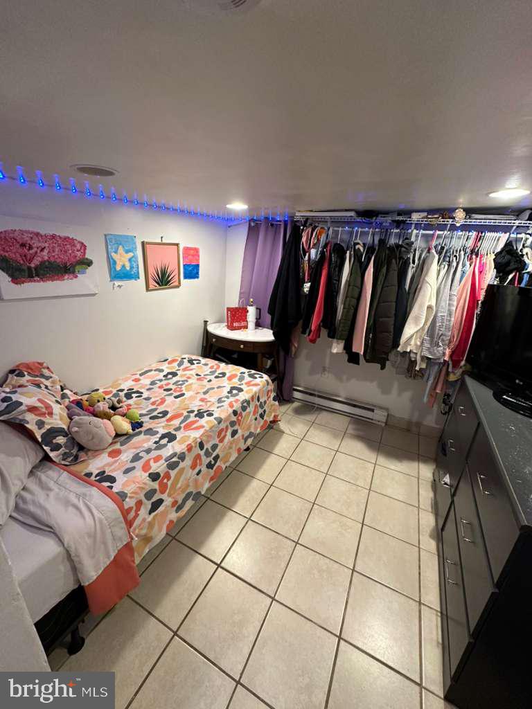 1536 Rothley Avenue Abington, PA 19090 - Photo 18 of 21 a bedroom with a bed and a walk in closet