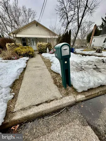 a front view of a house with yard