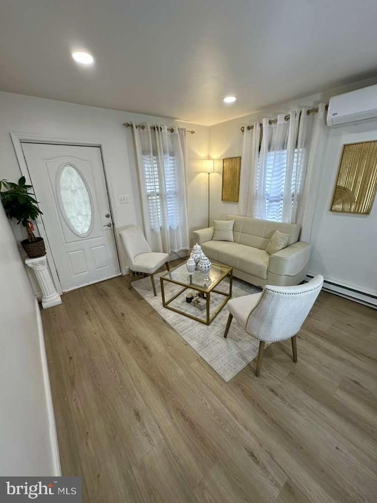 1536 Rothley Avenue Abington, PA 19090 - Photo 4 of 21 a living room with couch and a wooden floor