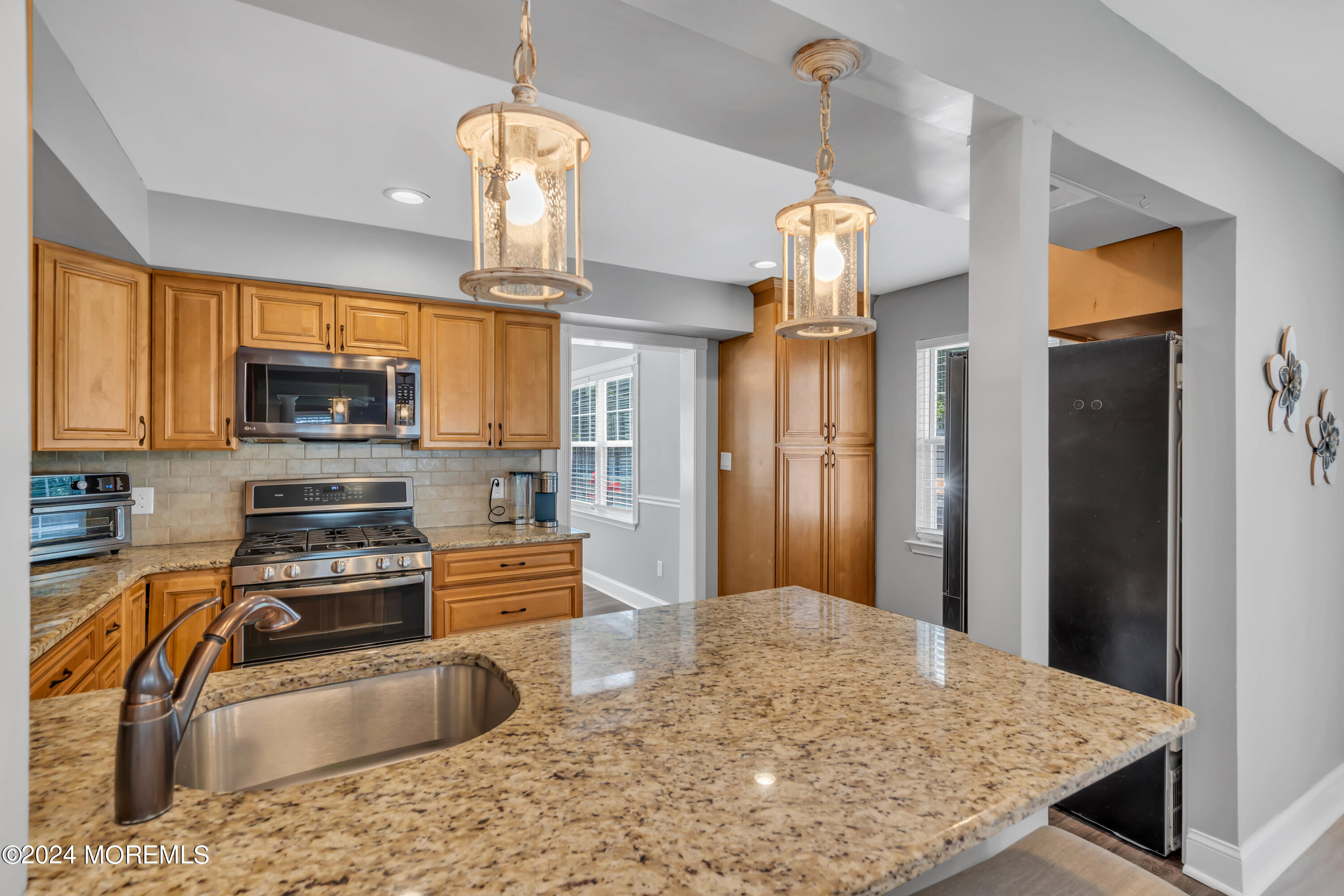 538 Adamston Road Brick, NJ 08723 - Photo 13 of 55 a kitchen with granite countertop a refrigerator a stove top oven a sink and dishwasher