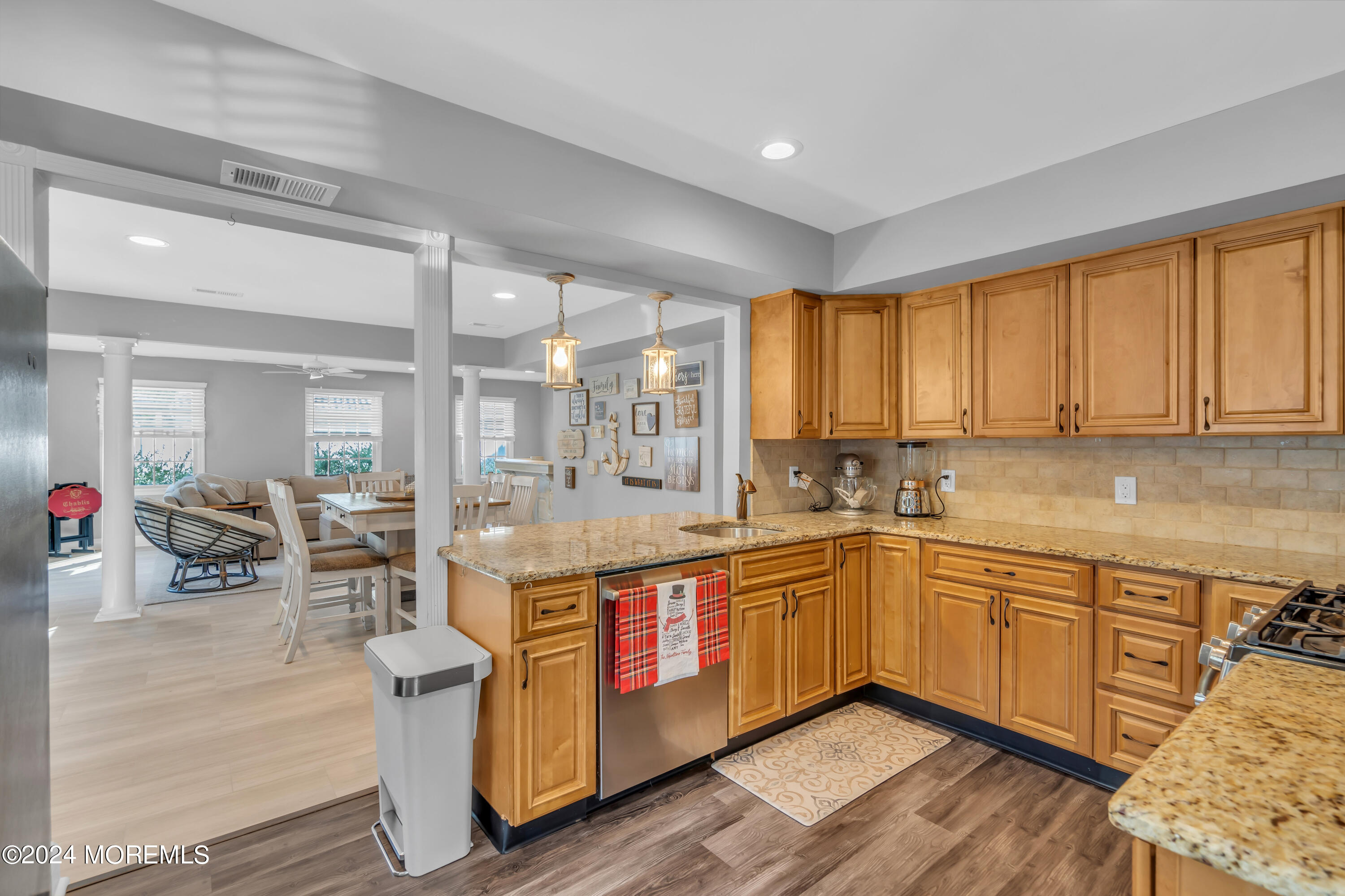 538 Adamston Road Brick, NJ 08723 - Photo 14 of 55 a large kitchen with stainless steel appliances granite countertop a lot of counter space and wooden floors