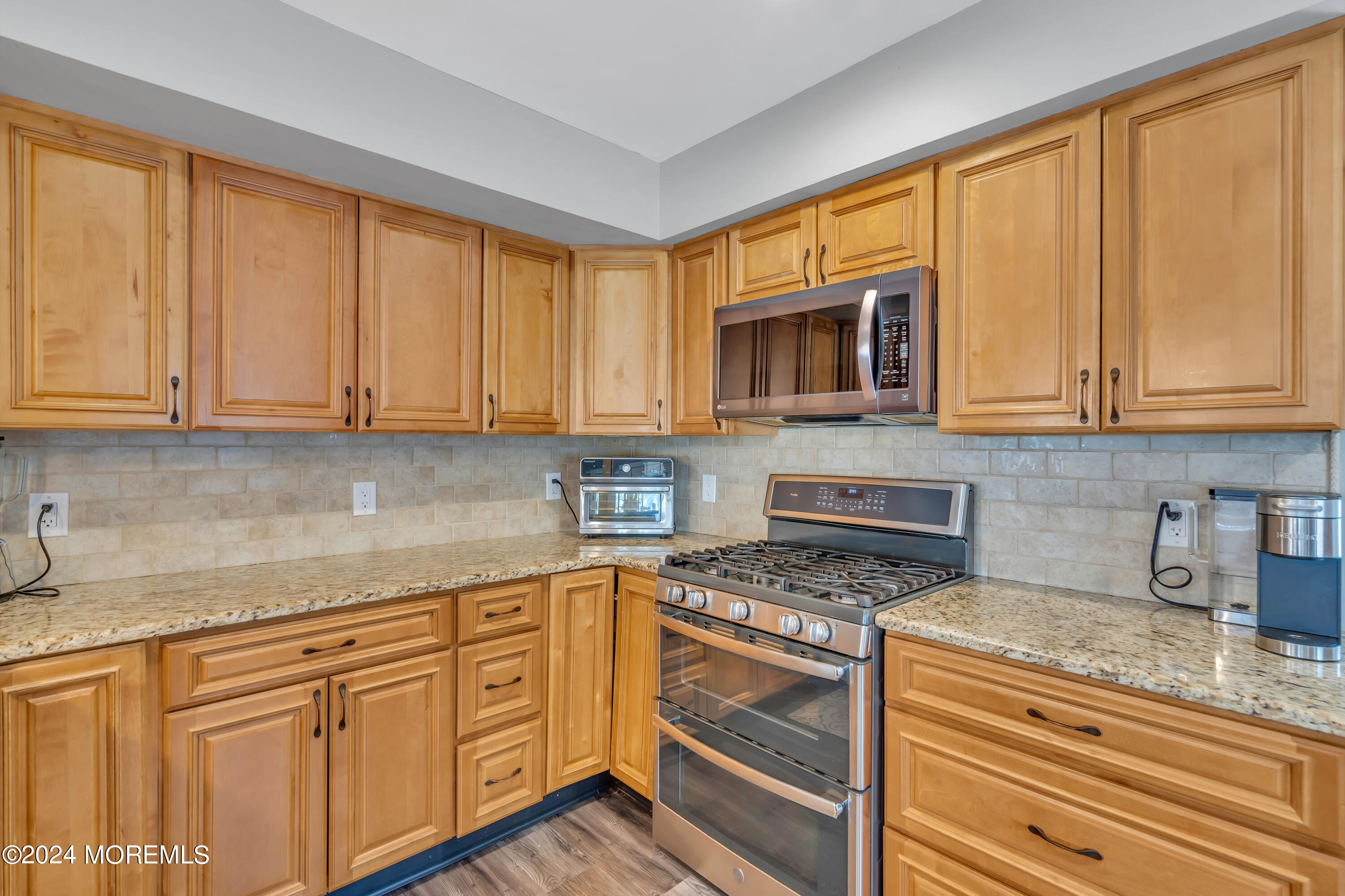 538 Adamston Road Brick, NJ 08723 - Photo 16 of 55 a kitchen with granite countertop white cabinets stainless steel appliances a sink and a window