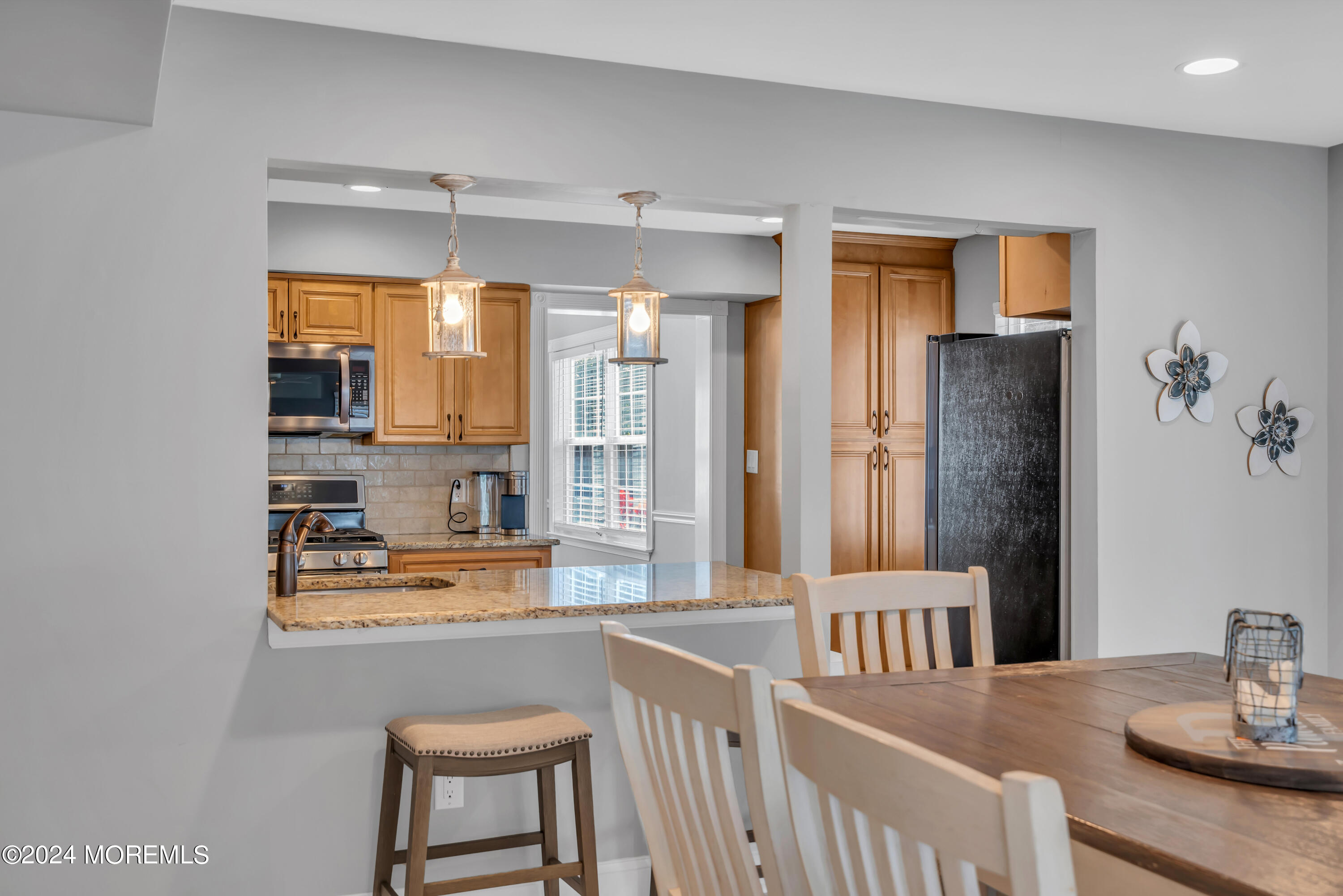 538 Adamston Road Brick, NJ 08723 - Photo 22 of 55 a kitchen with stainless steel appliances granite countertop a sink and a refrigerator