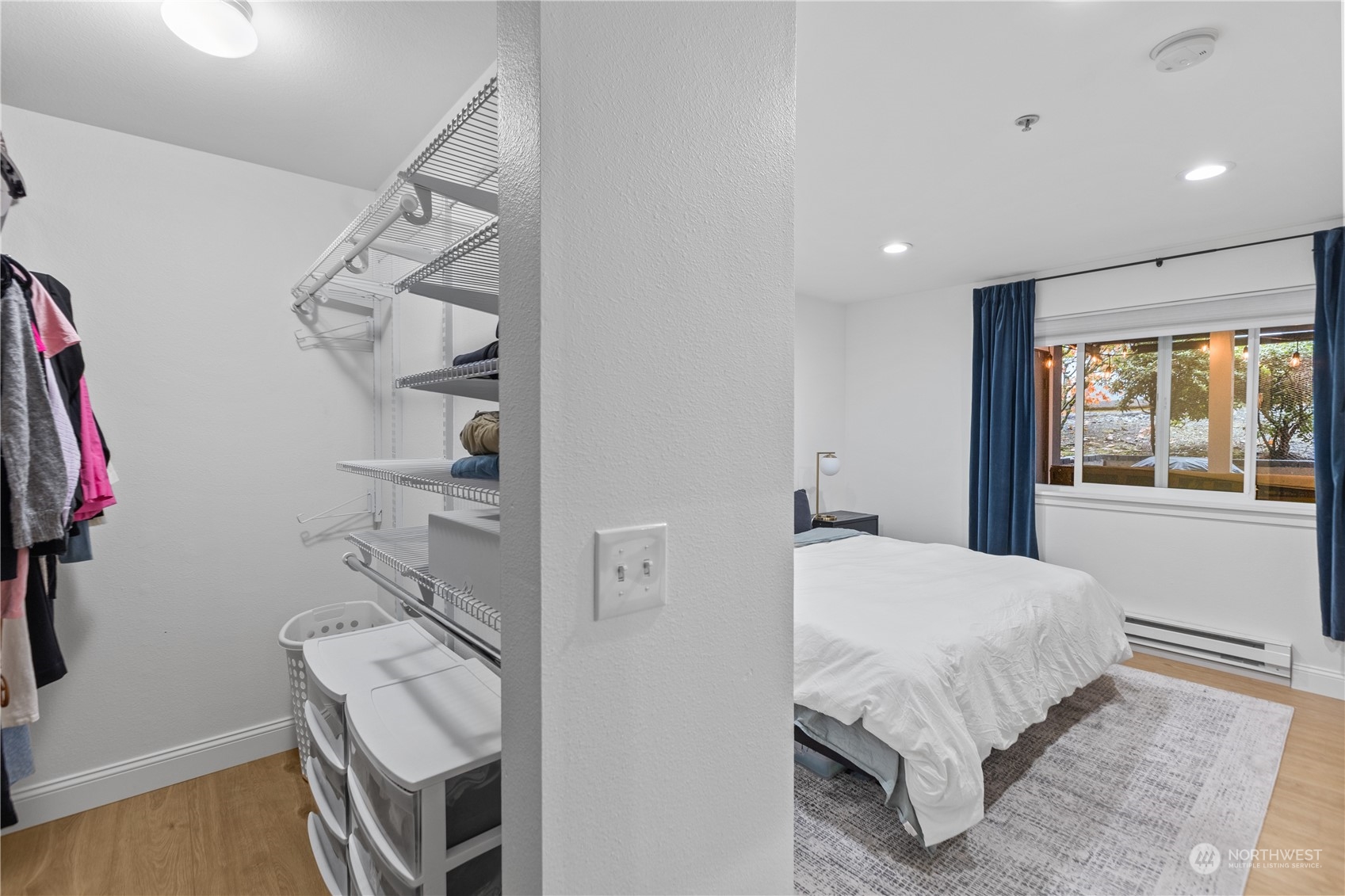 3921 243rd Place Southeast, Unit J104 Bothell, WA 98021 - Photo 17 of 40 a bedroom with a bed and a window