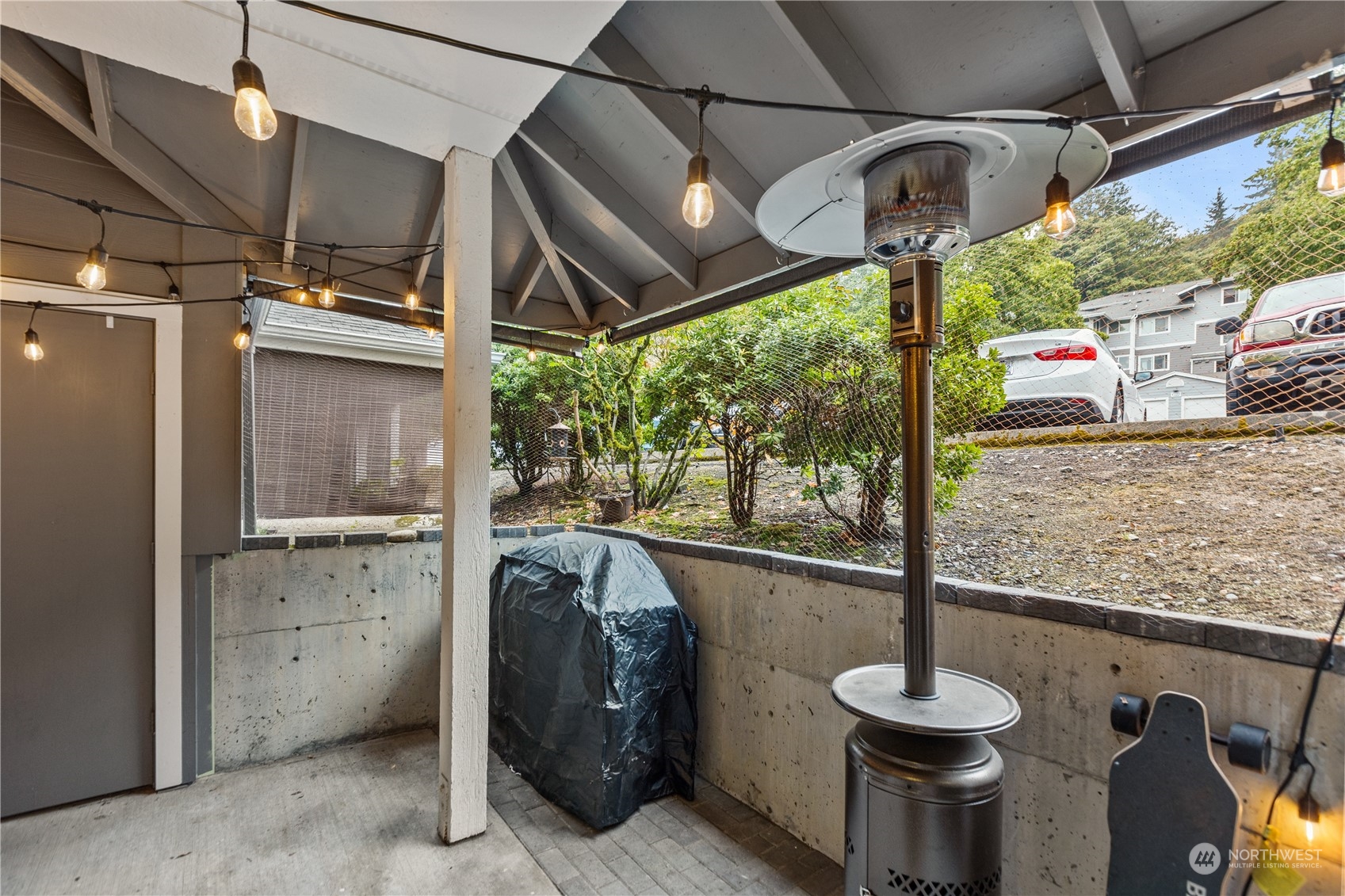 3921 243rd Place Southeast, Unit J104 Bothell, WA 98021 - Photo 25 of 40 a view of a porch with furniture and a grill