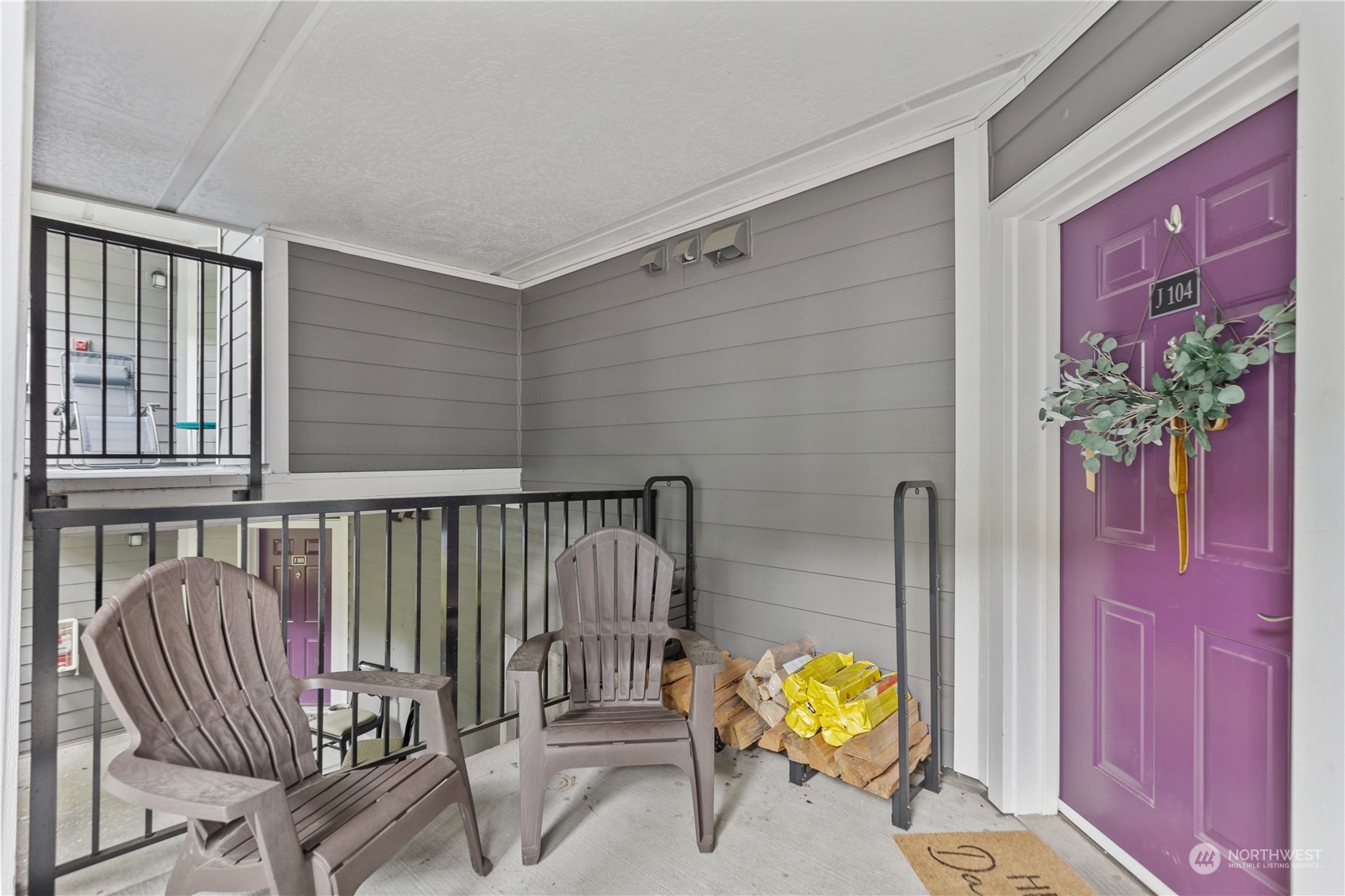 3921 243rd Place Southeast, Unit J104 Bothell, WA 98021 - Photo 28 of 40 a view of entryway with wooden floor