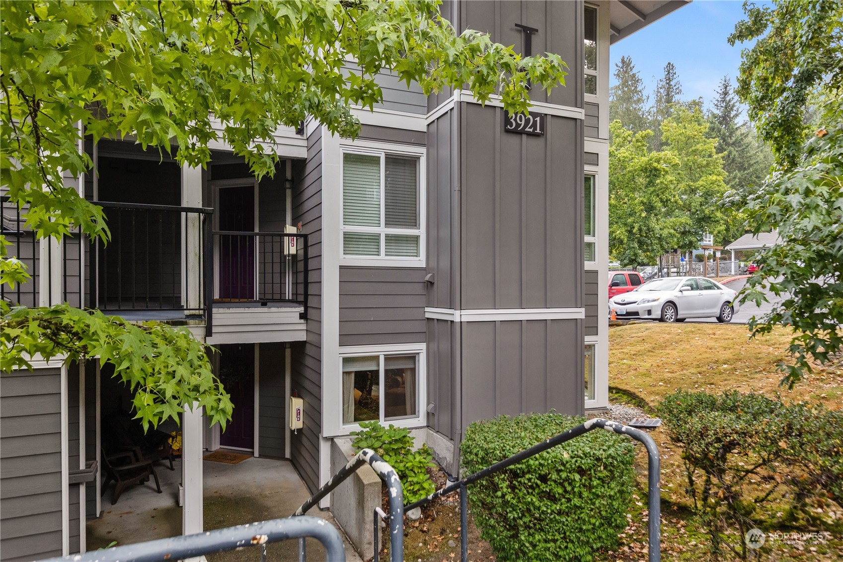 3921 243rd Place Southeast, Unit J104 Bothell, WA 98021 - Photo 30 of 40 a view of a house with backyard and sitting area