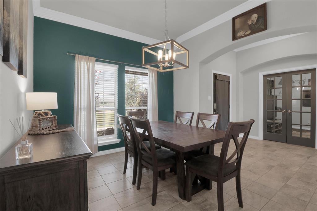 7818 Sagebrush Lane Godley, TX 76044 - Photo 12 of 38 a view of a dining room with furniture and window