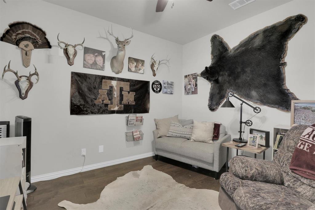 7818 Sagebrush Lane Godley, TX 76044 - Photo 31 of 38 a living room with furniture and wooden floor
