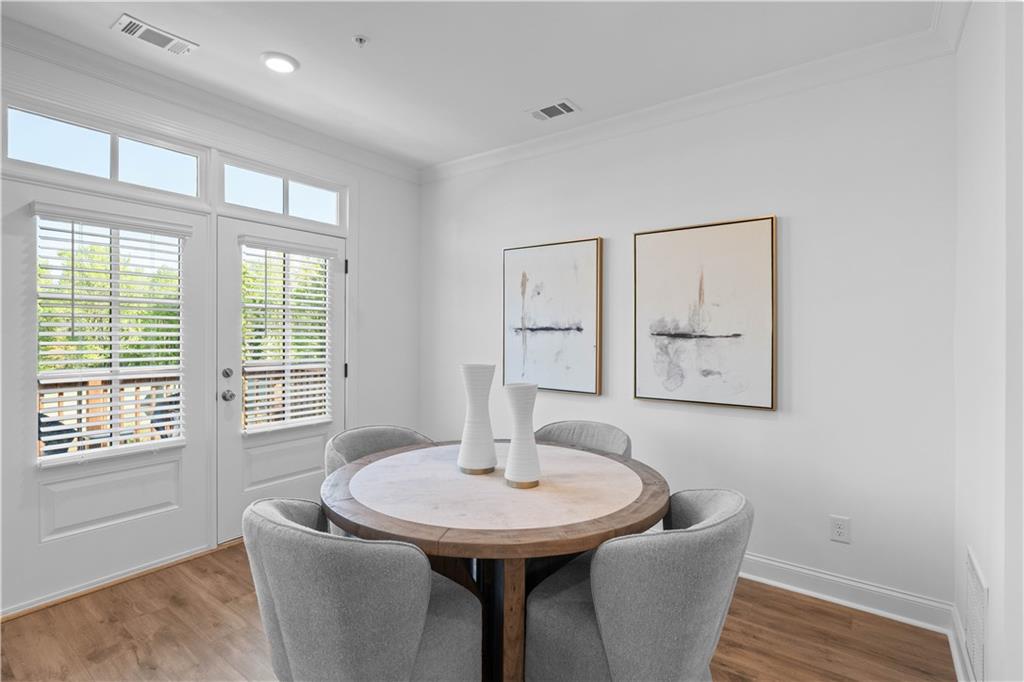 538 Alice Way, Unit D3 Cumming, GA 30040 - Photo 11 of 52 a dining room with furniture and window