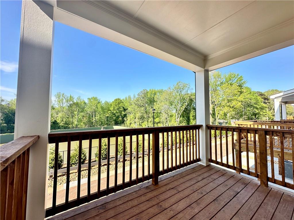 538 Alice Way, Unit D3 Cumming, GA 30040 - Photo 12 of 52 a view of a balcony with wooden floor