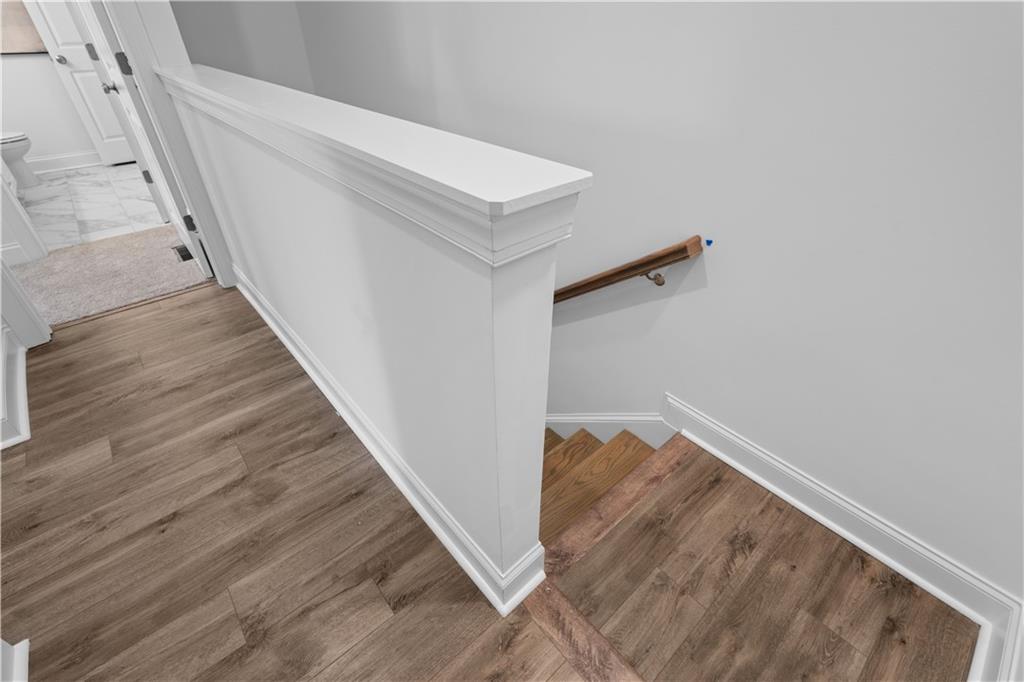 538 Alice Way, Unit D3 Cumming, GA 30040 - Photo 13 of 52 a view of staircase with white walls and white door