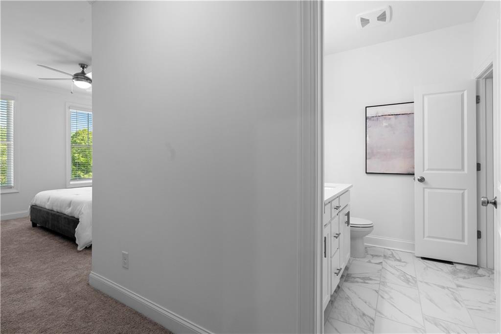 538 Alice Way, Unit D3 Cumming, GA 30040 - Photo 16 of 52 a bedroom with a bed and a window