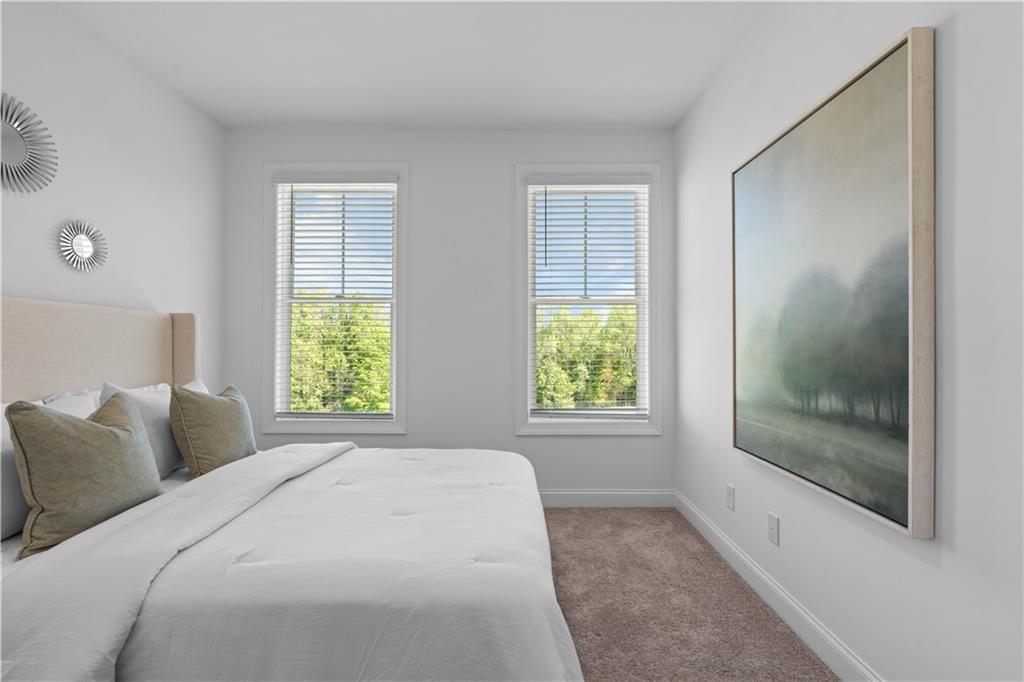 538 Alice Way, Unit D3 Cumming, GA 30040 - Photo 19 of 52 a bedroom with a bed and a window