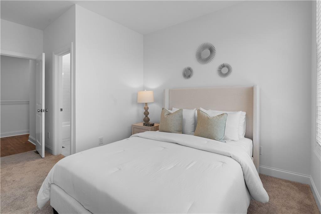 538 Alice Way, Unit D3 Cumming, GA 30040 - Photo 20 of 52 a bedroom with a bed and a window