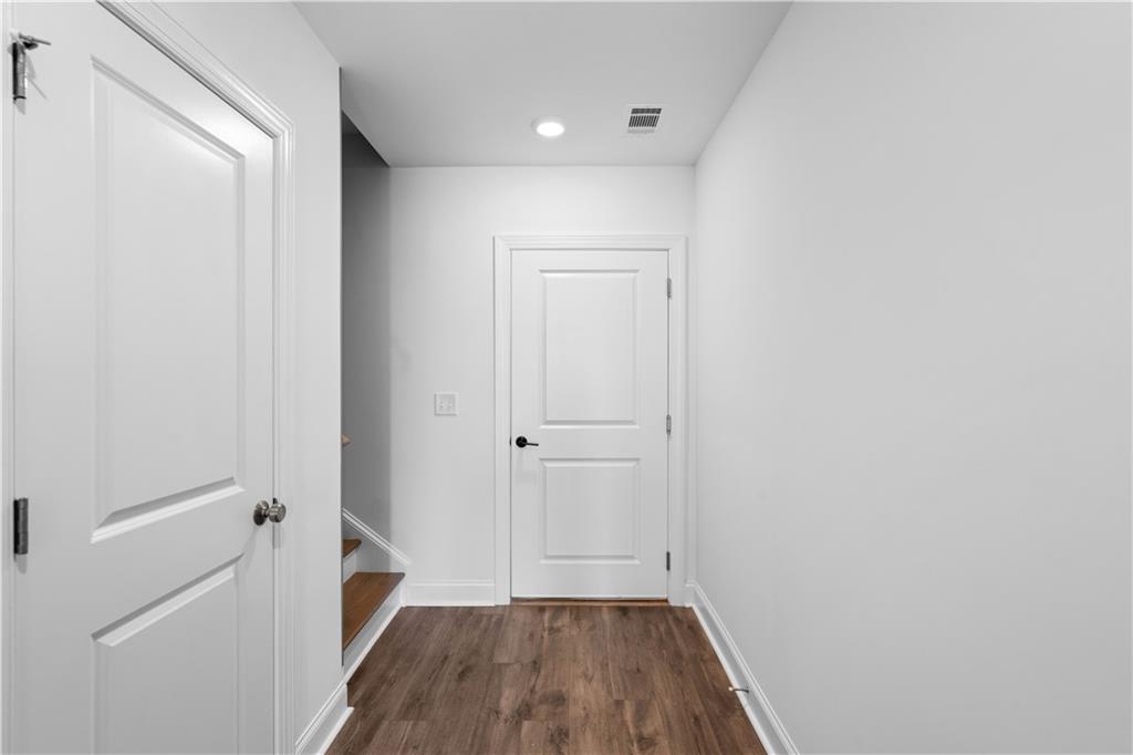 538 Alice Way, Unit D3 Cumming, GA 30040 - Photo 2 of 52 a view of a hallway with wooden floor